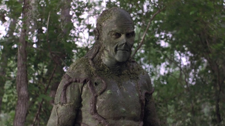 Swamp Thing (Dick Durock) standing in a forest in 