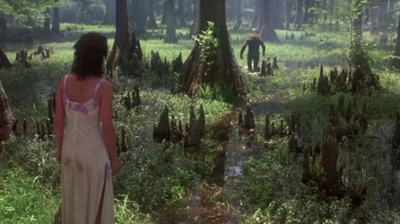 Alice (Adrienne Barbeau) looking at the eponymous monster (Dick Durock) in "Swamp Thing."