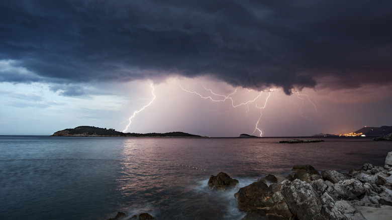 lightning strikes as a storm approaches the coast