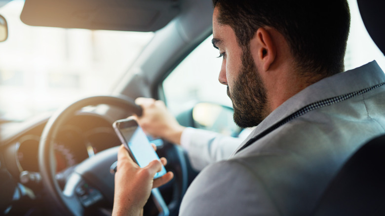 Person using their phone while driving