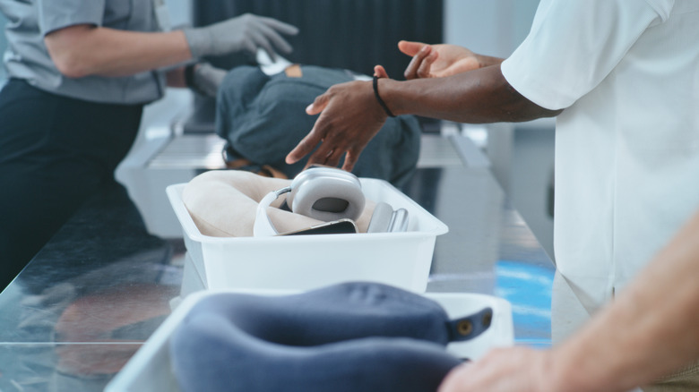 A TSA airport checkpoint looking at bags