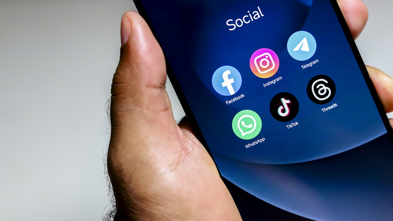 a bunch of social media app icons on a smartphone