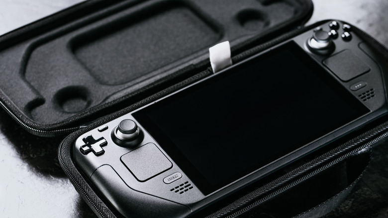 A Steam Deck portable gaming PC in a carrying case.