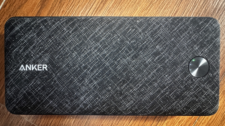 An Anker power bank showing a green trickle charging mode light