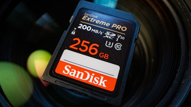 an SD card placed on top of a camera lens