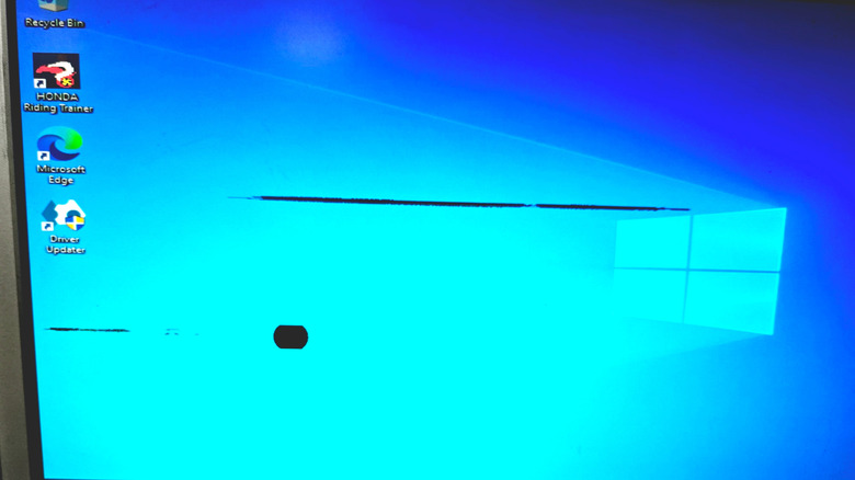 A computer monitor with multiple dead pixels.