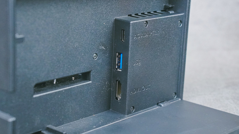 The back of the Nintendo Switch with the AC adapter, USB, and HDMI ports showing