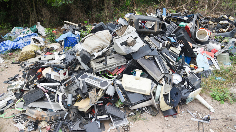 pile of electronic waste on the ground set aside for recycling