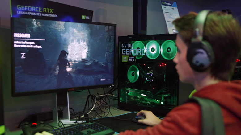 A gamer plays a video game on a computer equipped with a Nvidia GeForce RTX graphic card during the Paris Games Week on October 26, 2018 in Paris, France.