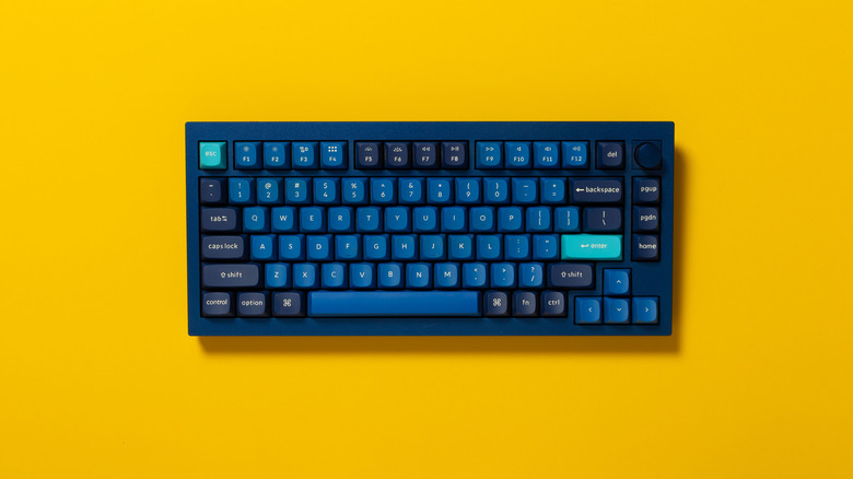 blue compact mechanical keyboard against bright background