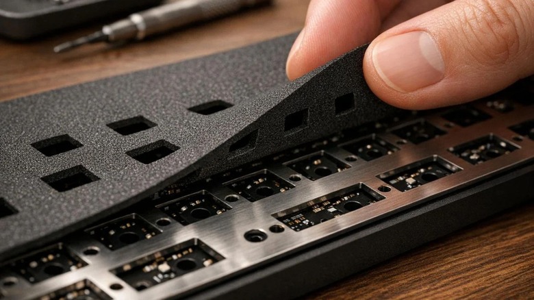 person installing keyboard foam