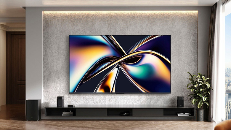 Hisense 65U8QG mounted on a wall in a living room