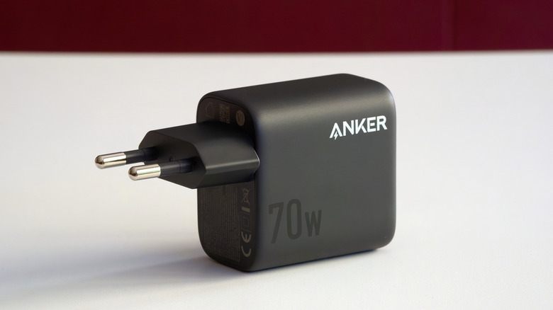 A black Anker charging brick