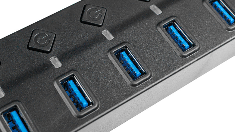 A USB hub showing USB ports with blue plastic inserts