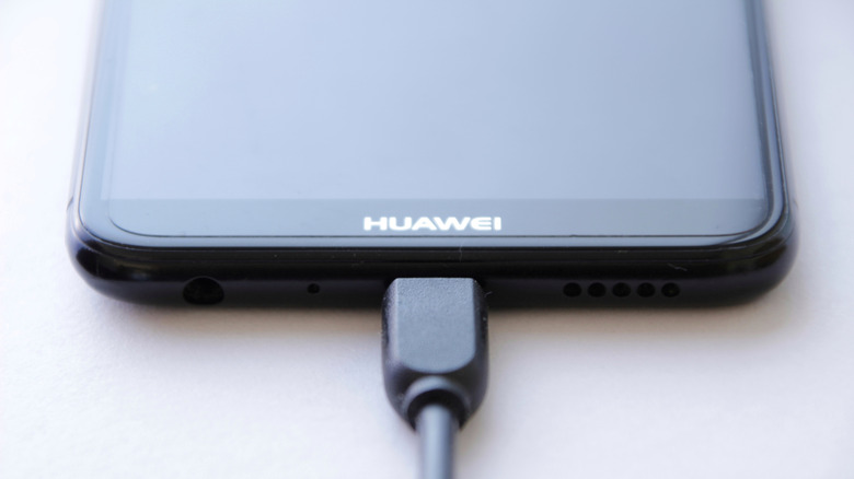 Charging a Huawei smartphone.