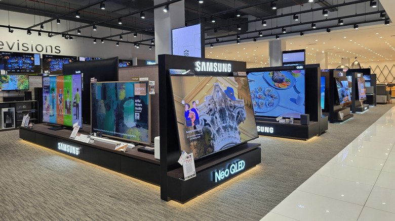 Samsung Neo QLED TVs on display at a retail outlet.