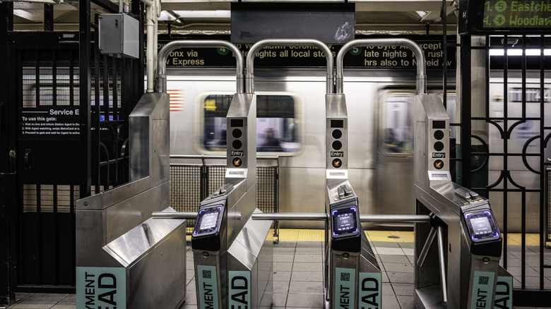 Tap-to-pay OMNY fare readers adorn an entrance to a New York subway station.