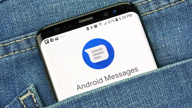 Android phone in pocket displaying Android Messages