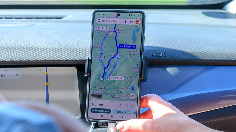 A person using Google Maps in Germany, with the map and UI showing various shades of blue.