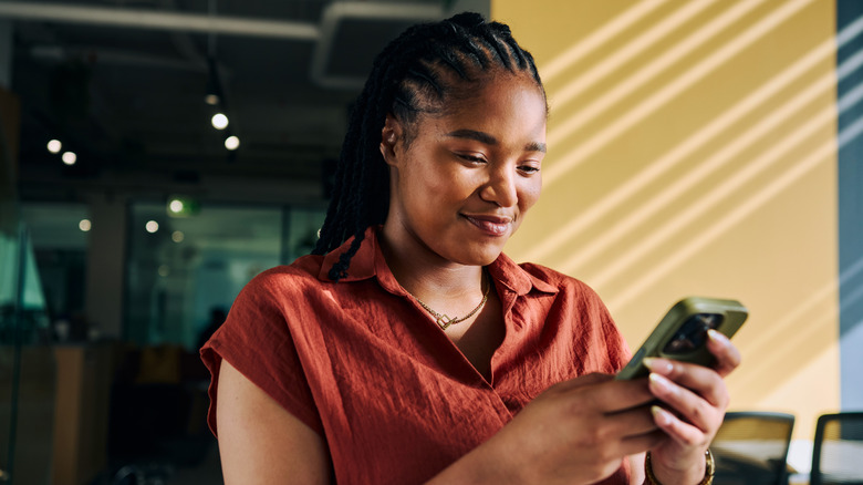 A woman looking at her phone.