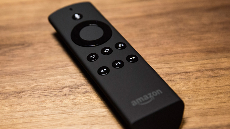 An Amazon Fire TV remote on a wood surface