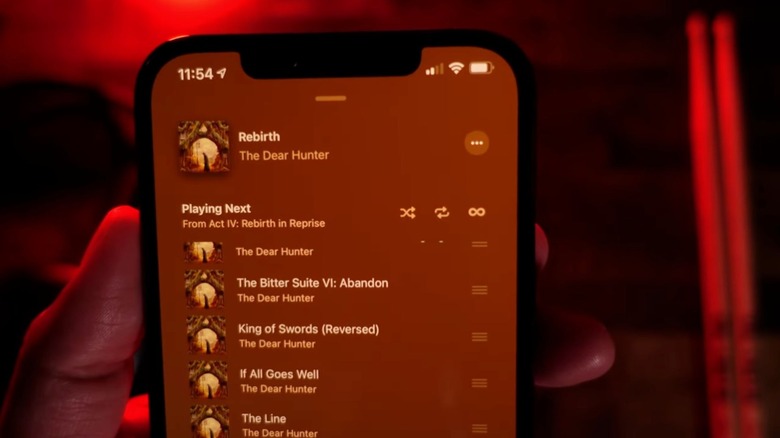 person showing infinity symbol Autoplay in Apple Music