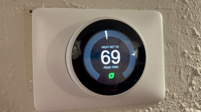 A Nest Thermostat achieving a Nest Leaf temperature during peak use hours, set to heat at 69 degrees Fahrenheit.