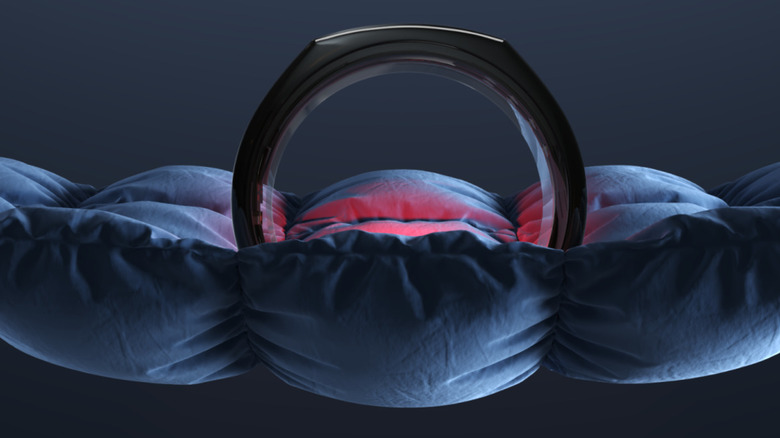 Oura Ring with a red light illuminated on it