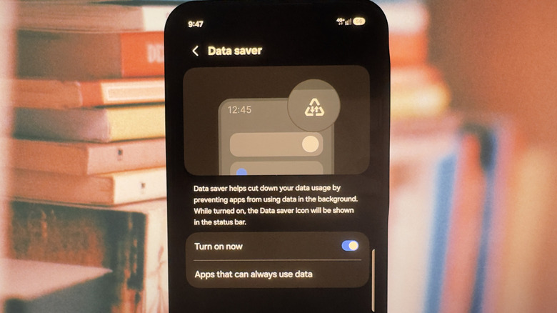 A Samsung phone showing the Data saver settings with a triangle symbol