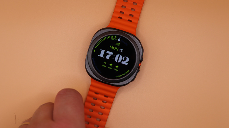 A Galaxy Watch Ultra with an orange strap.