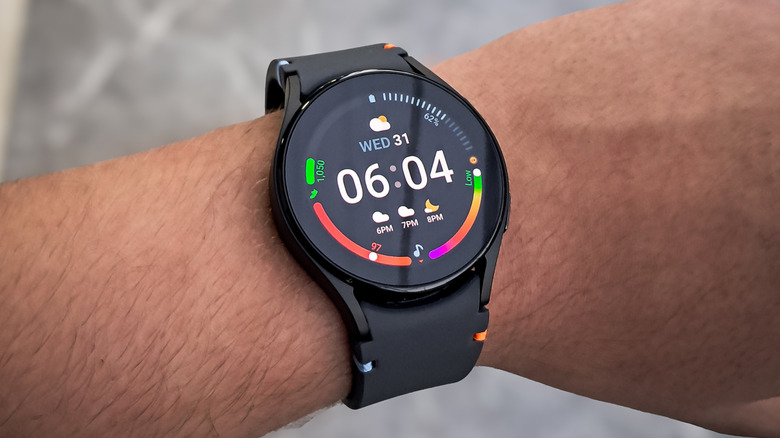 A black Galaxy Watch on a person's wrist.