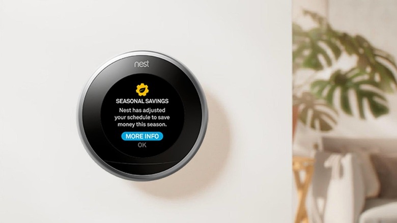 Google Nest learning thermostat on the wall.