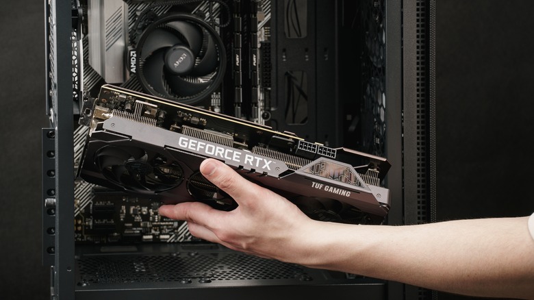 An Nvidia Geforce graphics card being installed into a PC