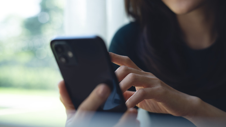 A woman using a smartphone