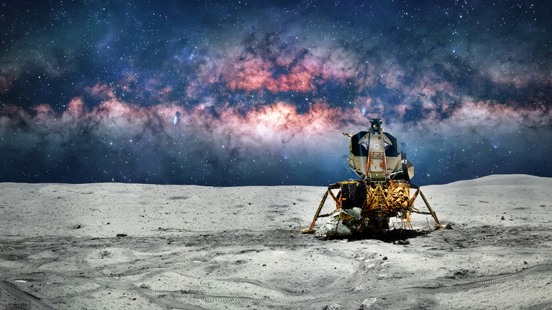 A lunar module on the moon with a celestial view in the background.