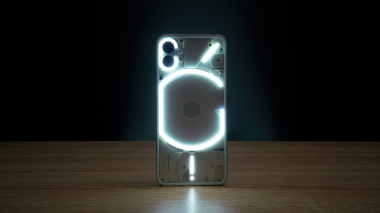 Back view of the Nothing Phone 1 showcasing its lit-up Glyph interface