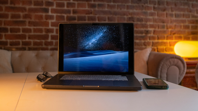 Laptop computer open to screensaver image.