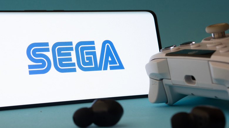 Smartphone featuring Sega logo next to gaming controller
