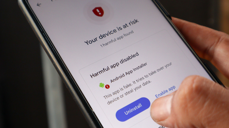 A smartphone showing a Google Play Protect alert