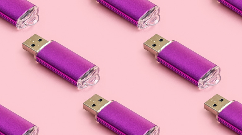 purple USB sticks on a pink backdrop