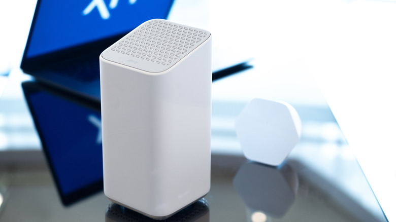 old white XFi Gateway sitting on a table