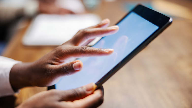 Close-up image of someone using an iPad