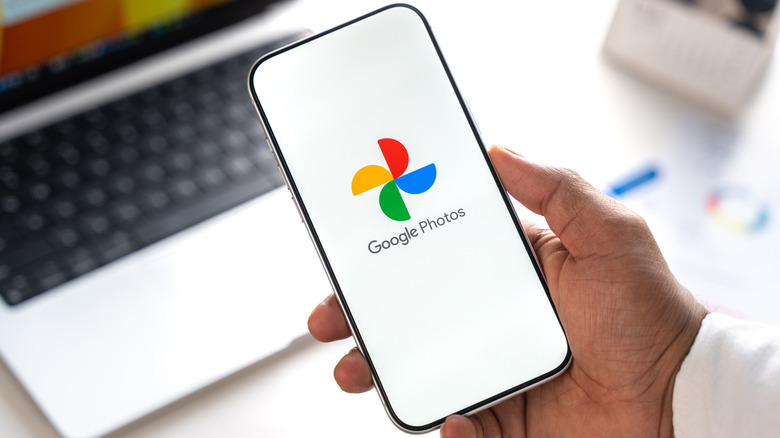 The Google Photos logo on a smartphone display.