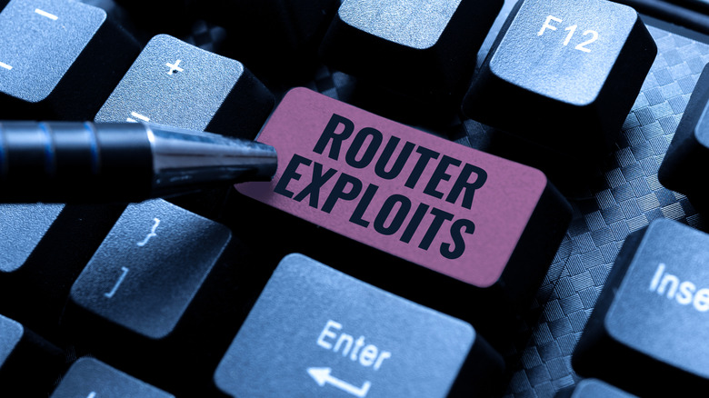 A close-up of the the Enter key on a keyboard, except that it says Router Exploits instead of Enter, and it's being pressed by a pen