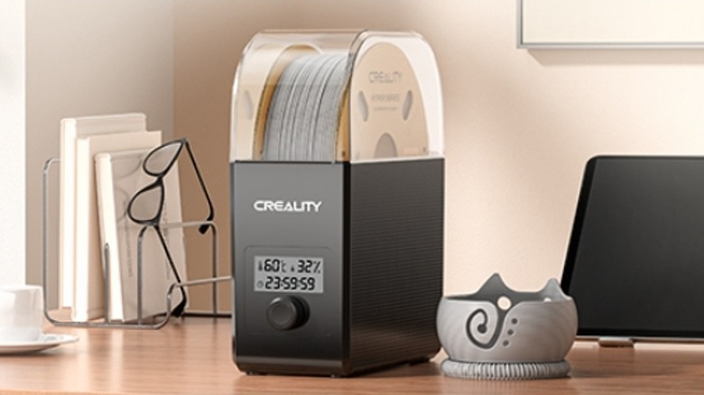 Creality filament dry box on top of wooden desk