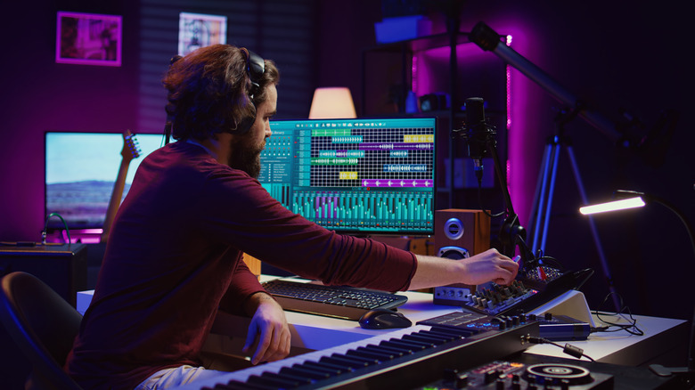 A music producer editing digital audio files