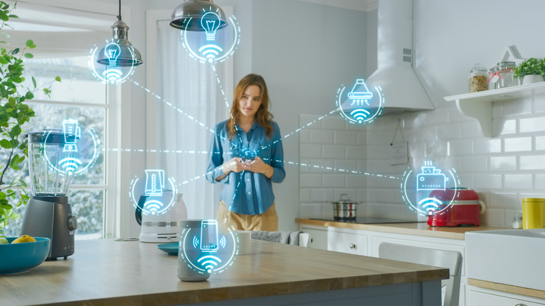 Visualization of a smart home ecosystem with virtual icons floating in front of a woman holding a phone