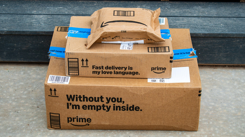 A stack of Amazon packages aligned neatly on top of each other, the packages are stacked from largest to smallest