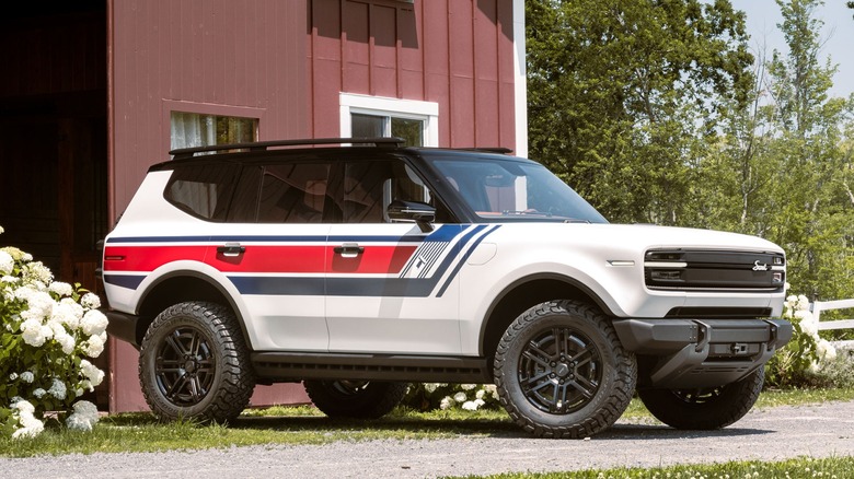 Scout Motors' Scout Traveler Spirit of 76 EV outside a farmhouse
