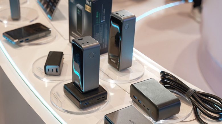 A variety of Anker charging accessories on a display table.